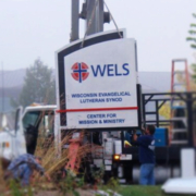 Installing the new sign at WELS Center for Mission and Ministry