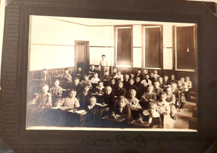 Students at St. John’s, Two Rivers, Wis., with their teacher, Miss Christina Damler, c. 1890.